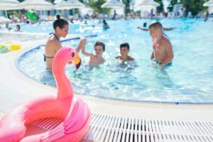 Kids swimming in a pool 