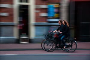 Two Women Riding Bicycle